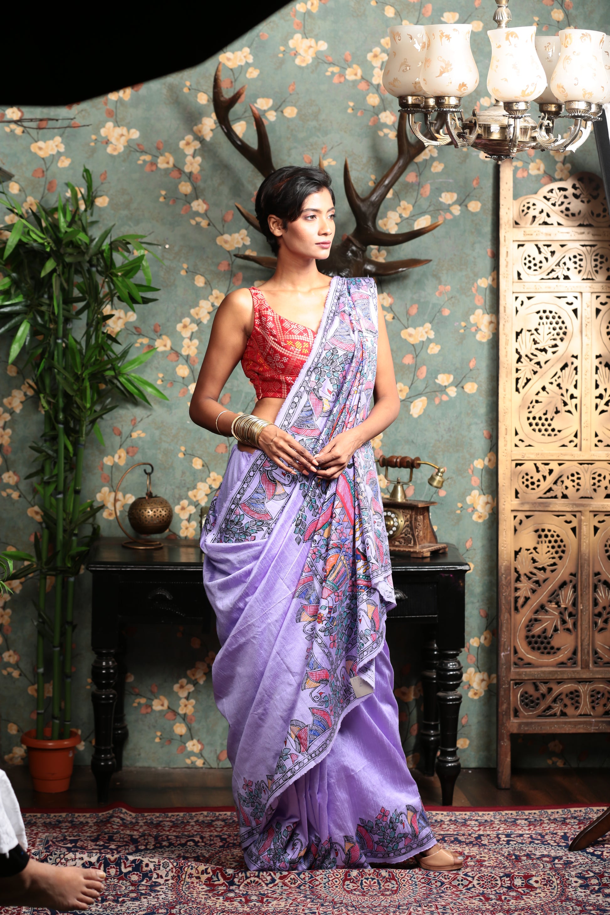 Woman in a vibrant mauve Tussar silk Madhubani painting saree, perfect for festive occasions. | Urbane Essence
