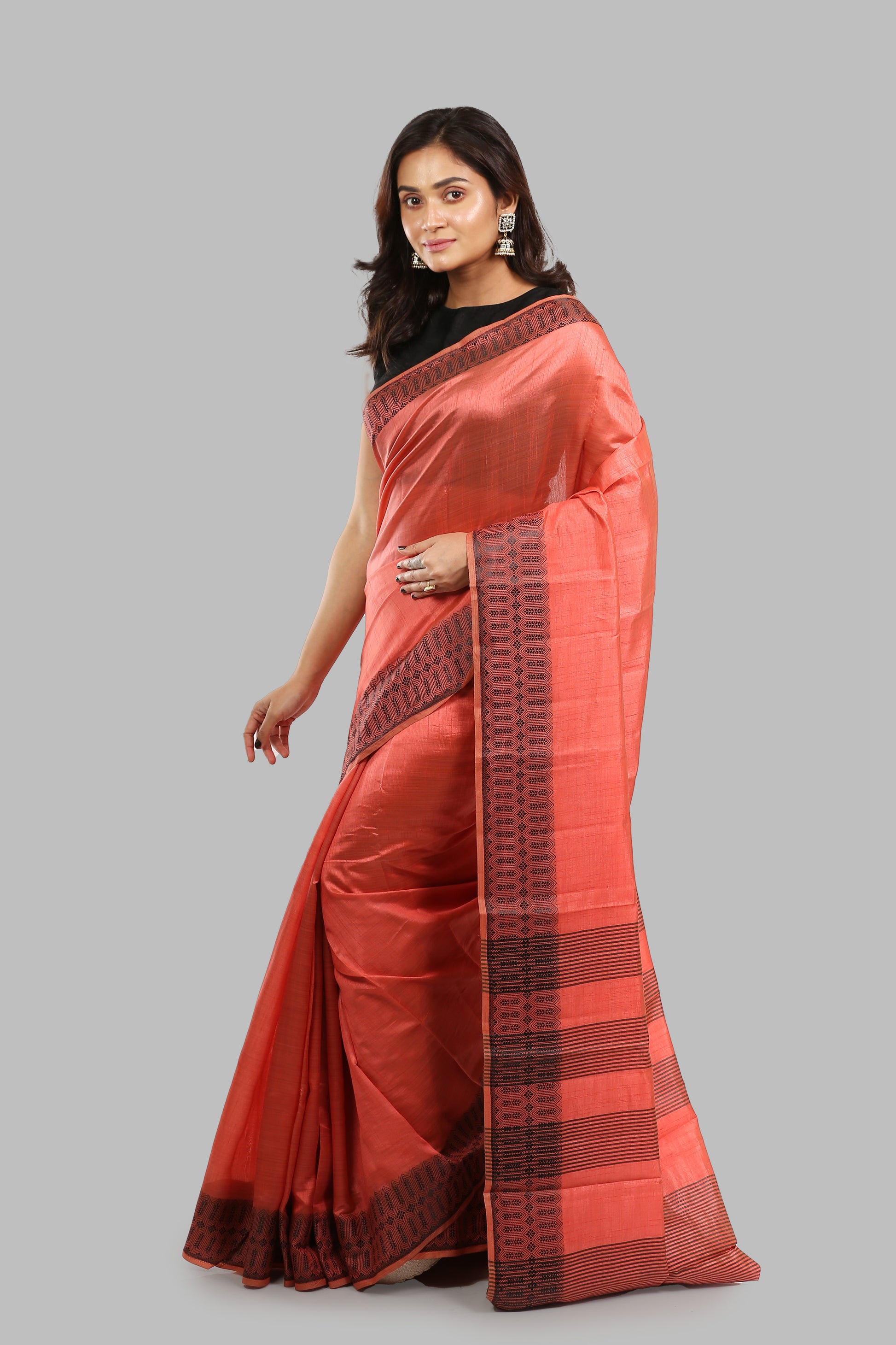 Sun-kissed rosewood raw silk saree with broad green border, golden zari patterns, perfect for traditional occasions | Urbane Essence