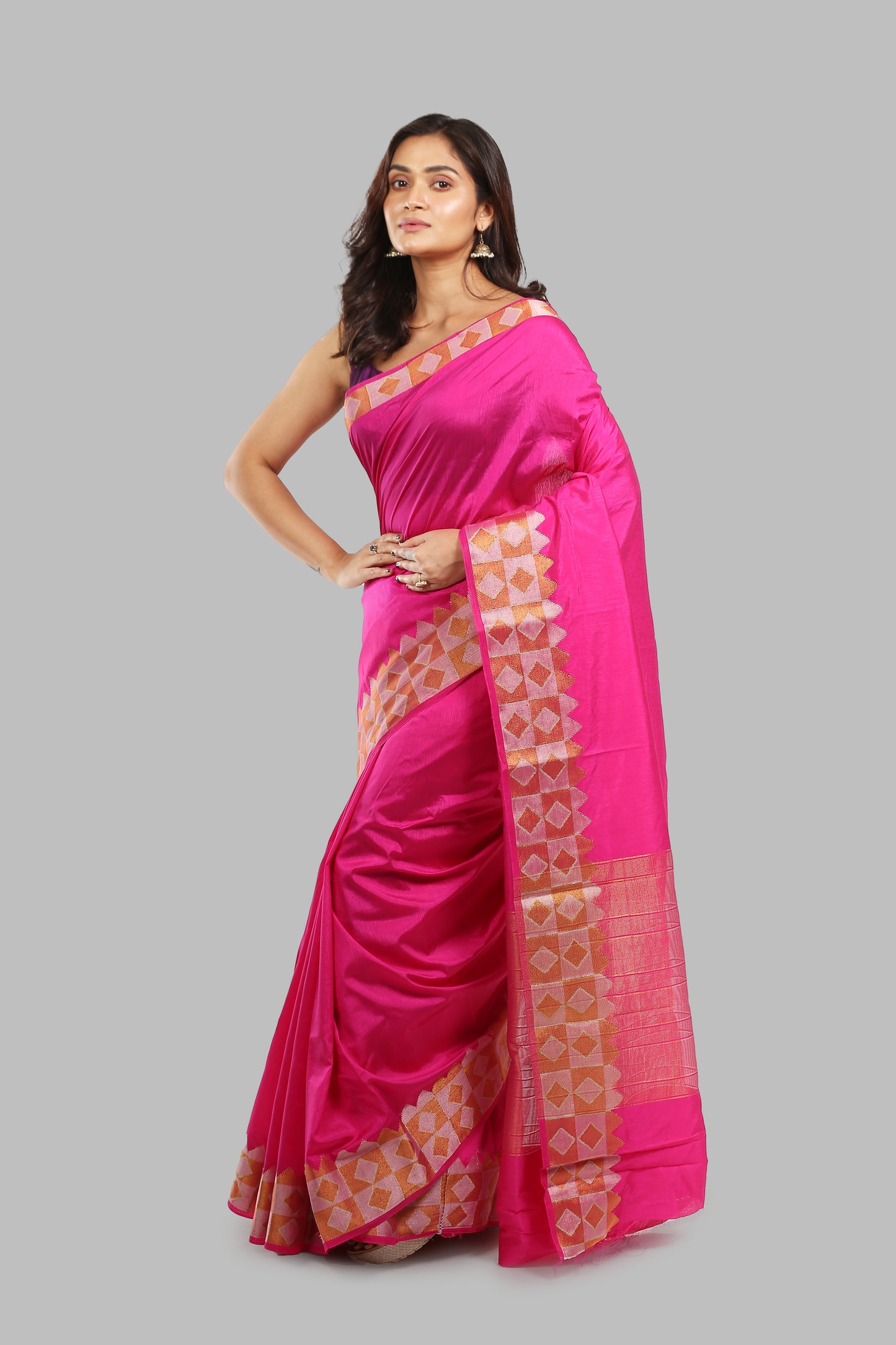 Sun-kissed Rosewood raw silk saree with broad green border, golden zari patterns, perfect for traditional occasions | Urbane Essence