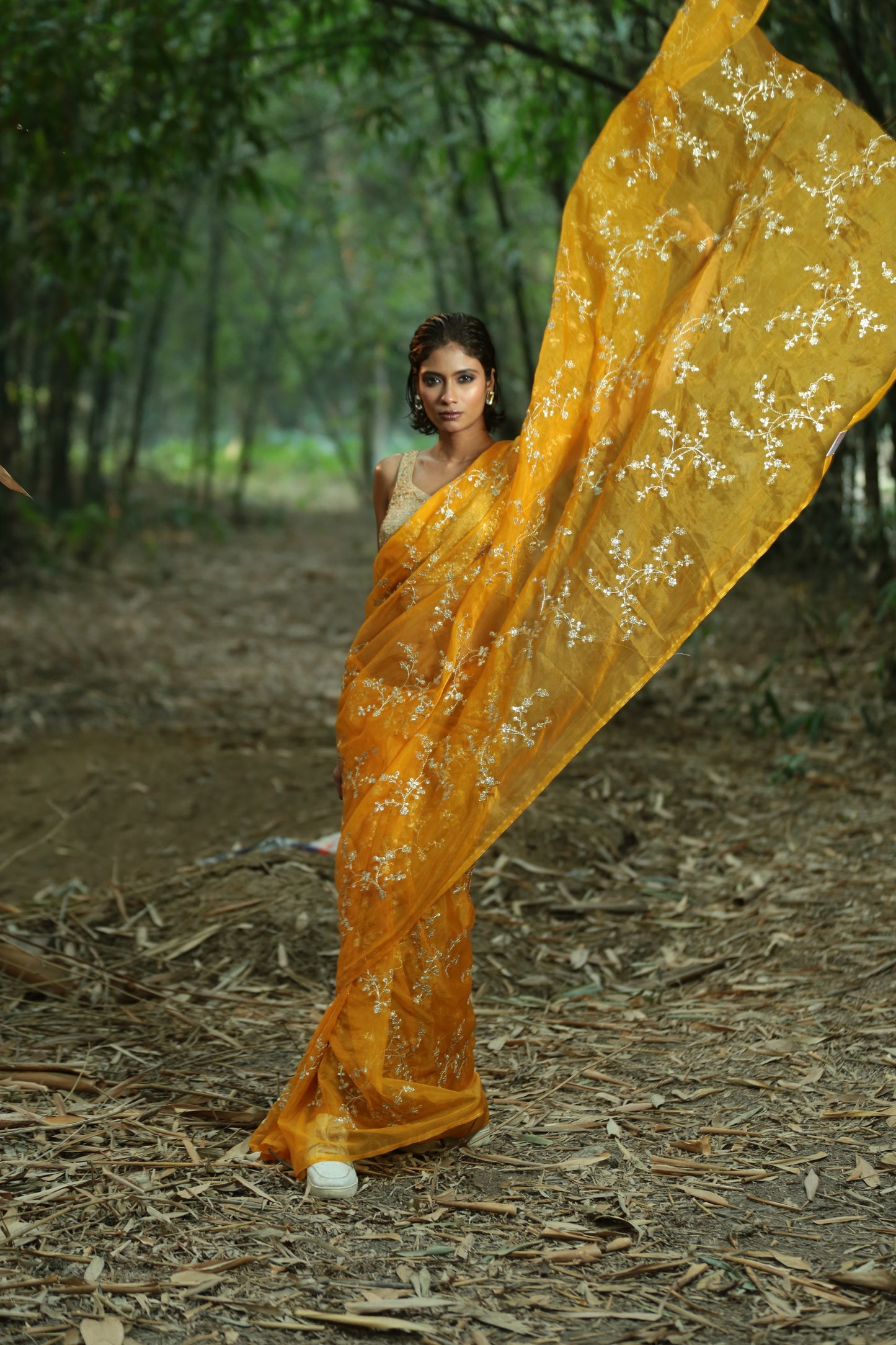 Mustard organza saree with intricate golden threaded patterns, perfect for special occasions. | Urbane Essence