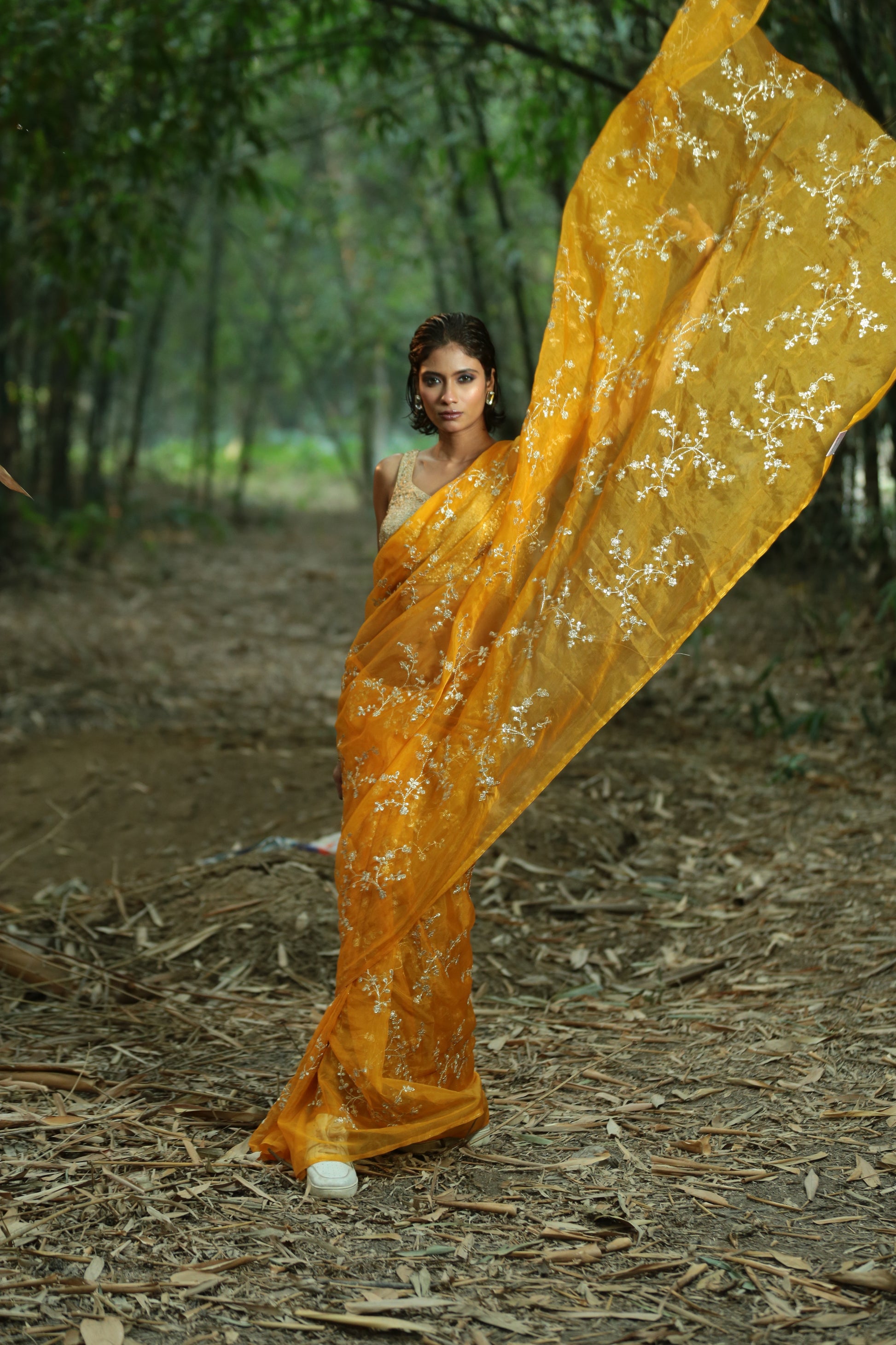 Mustard organza saree with intricate golden threaded patterns, perfect for special occasions. | Urbane Essence