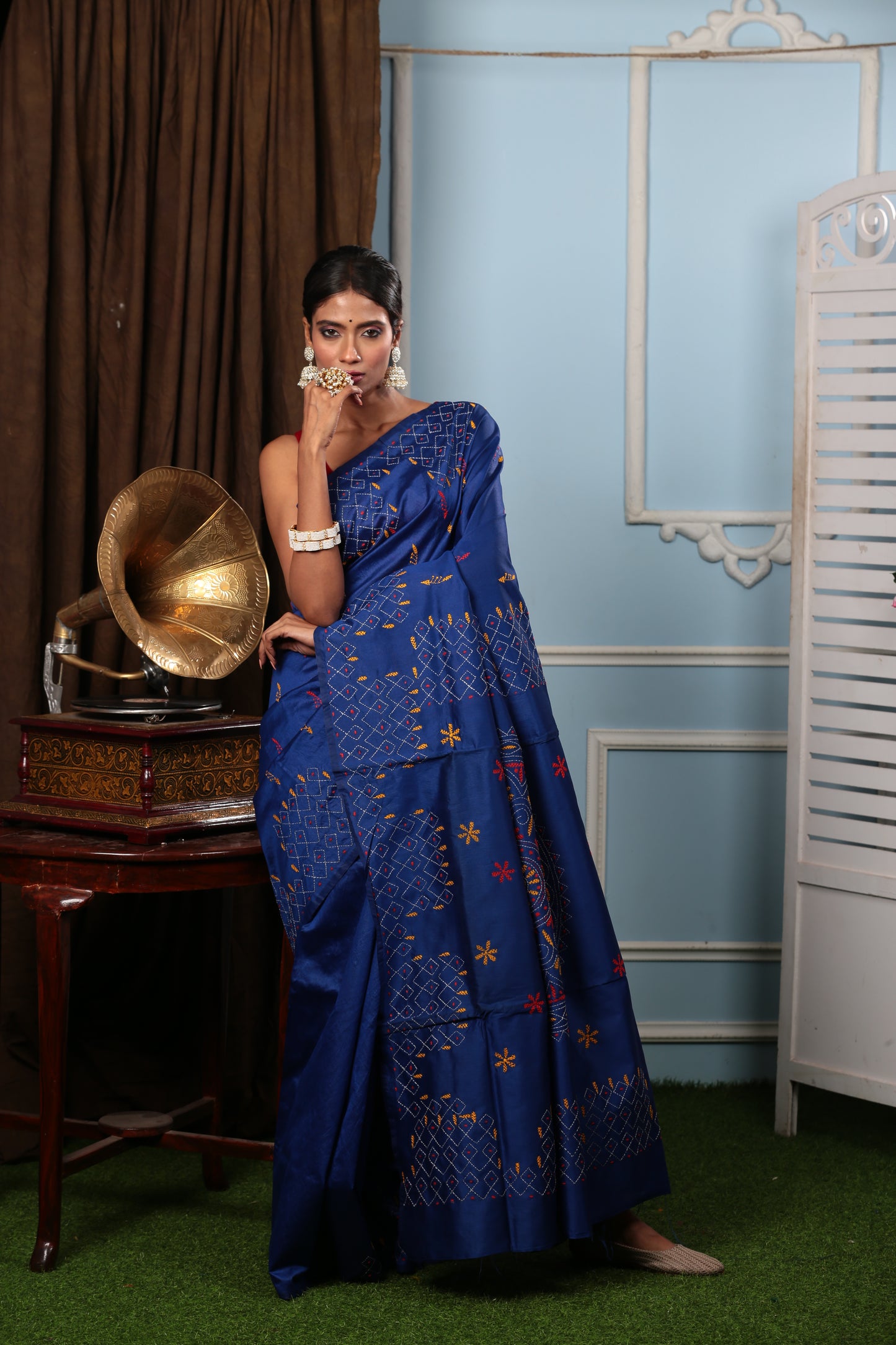 Model in a blue cotton Kantha saree with yellow & green designs, ideal for a cocktail event | Urbane Essence