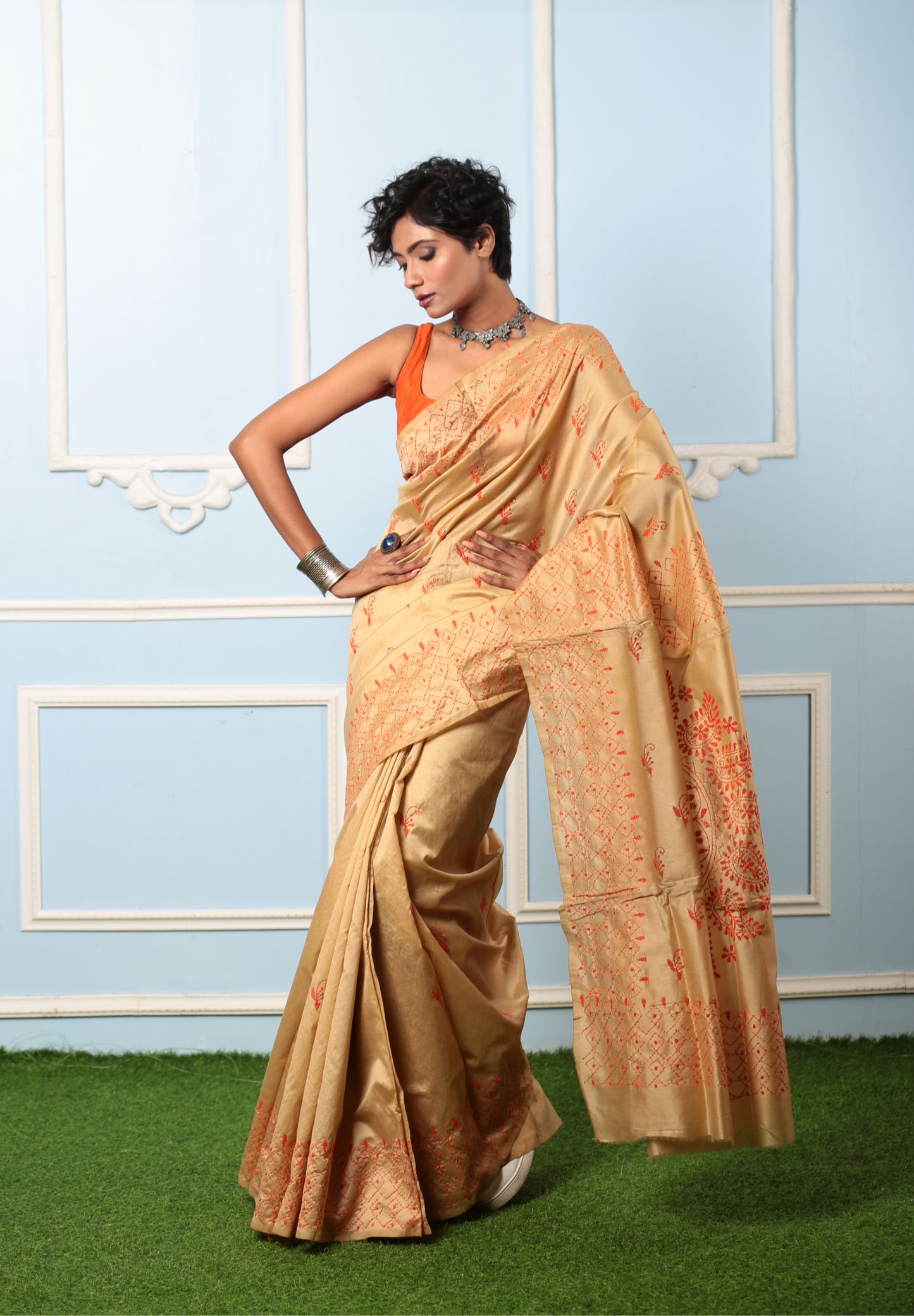 Model in a beige cotton Kantha saree with orange embroidery, perfect for a girls' day out or cocktail event | Urbane Essence