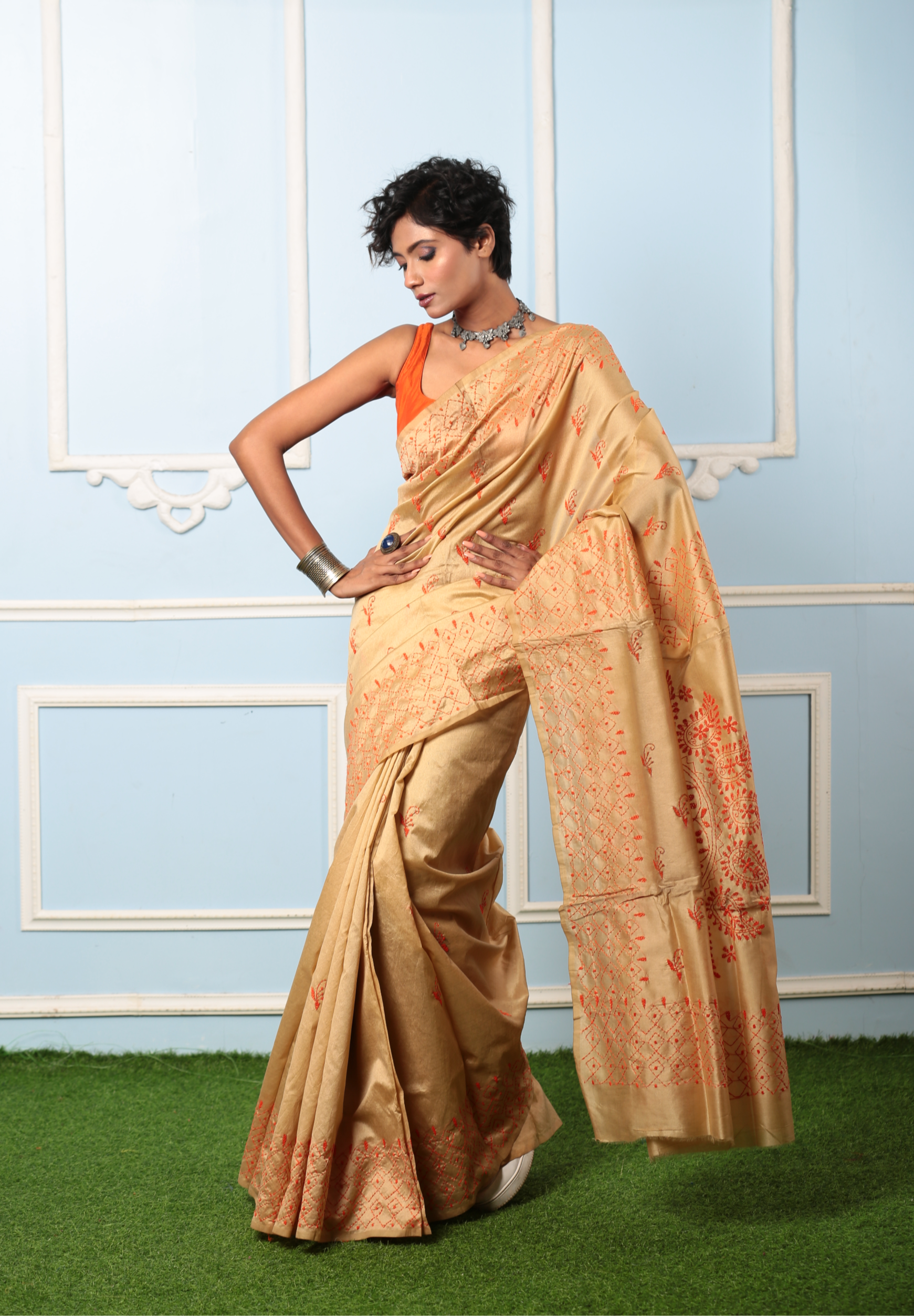Model in a beige cotton Kantha saree with orange embroidery, perfect for a girls' day out or cocktail event | Urbane Essence