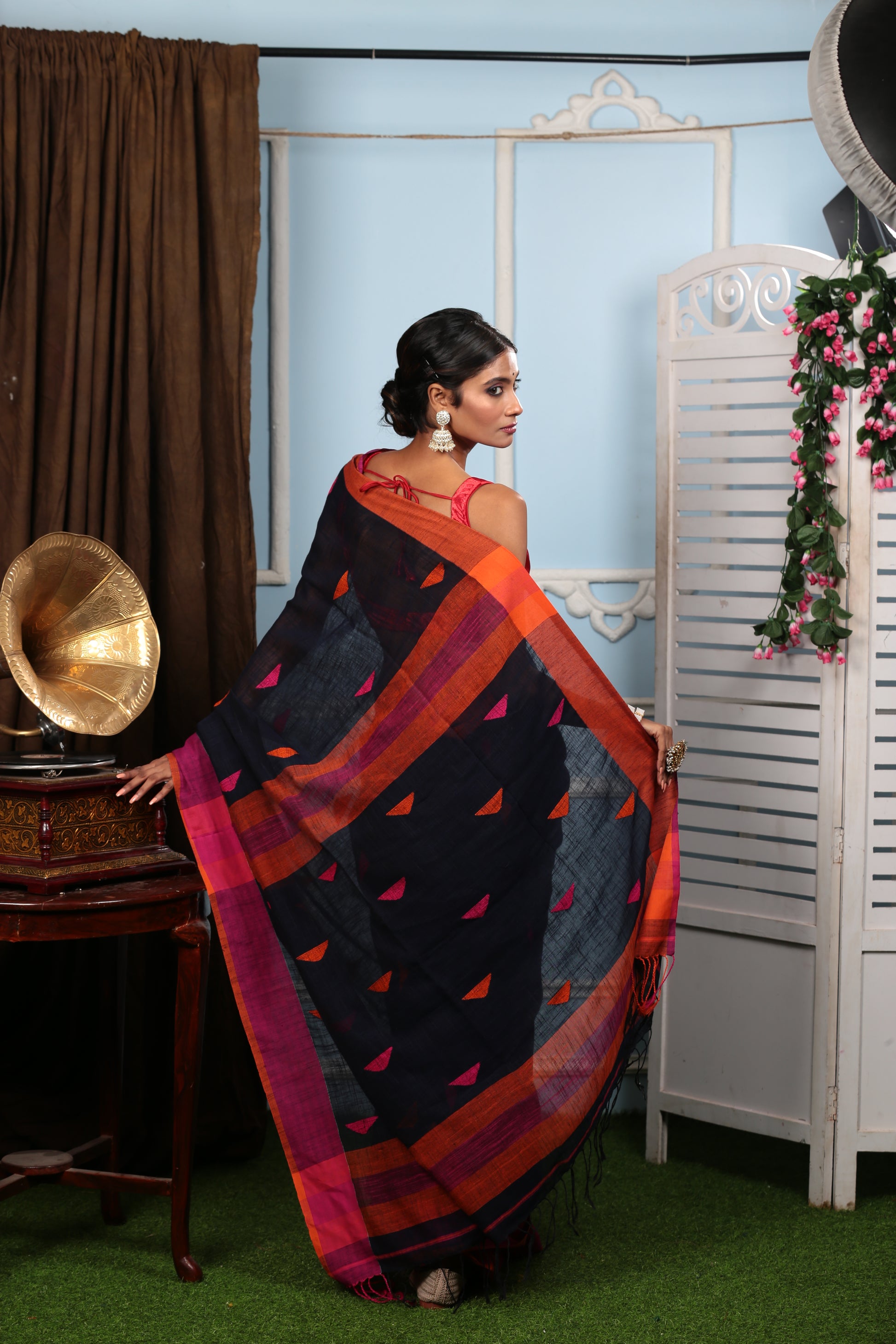 Assamese Khadi Saree in black with vibrant orange and pink stripes, perfect for festive occasions. | Urbane Essence