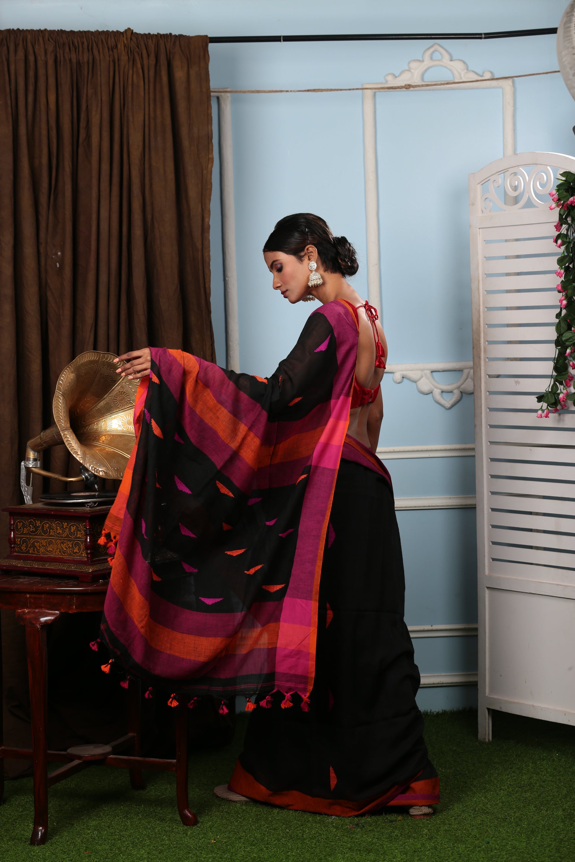 Assamese Khadi saree in black with vibrant pink and orange stripes, perfect for festive occasions. | Urbane Essence