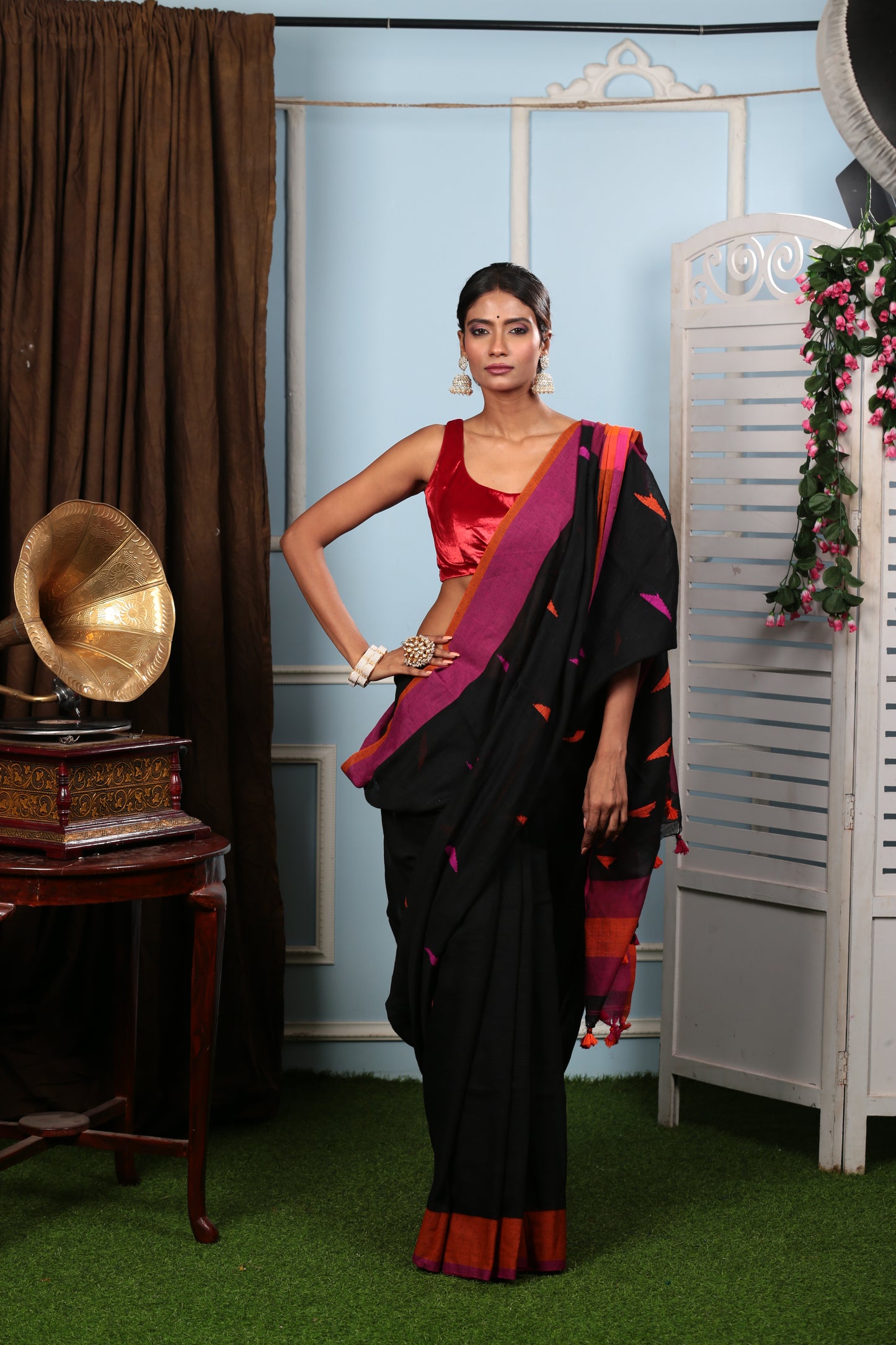 Assamese Khadi Saree in black with vibrant pink and orange geometric patterns, perfect for festive occasions | Urbane Essence