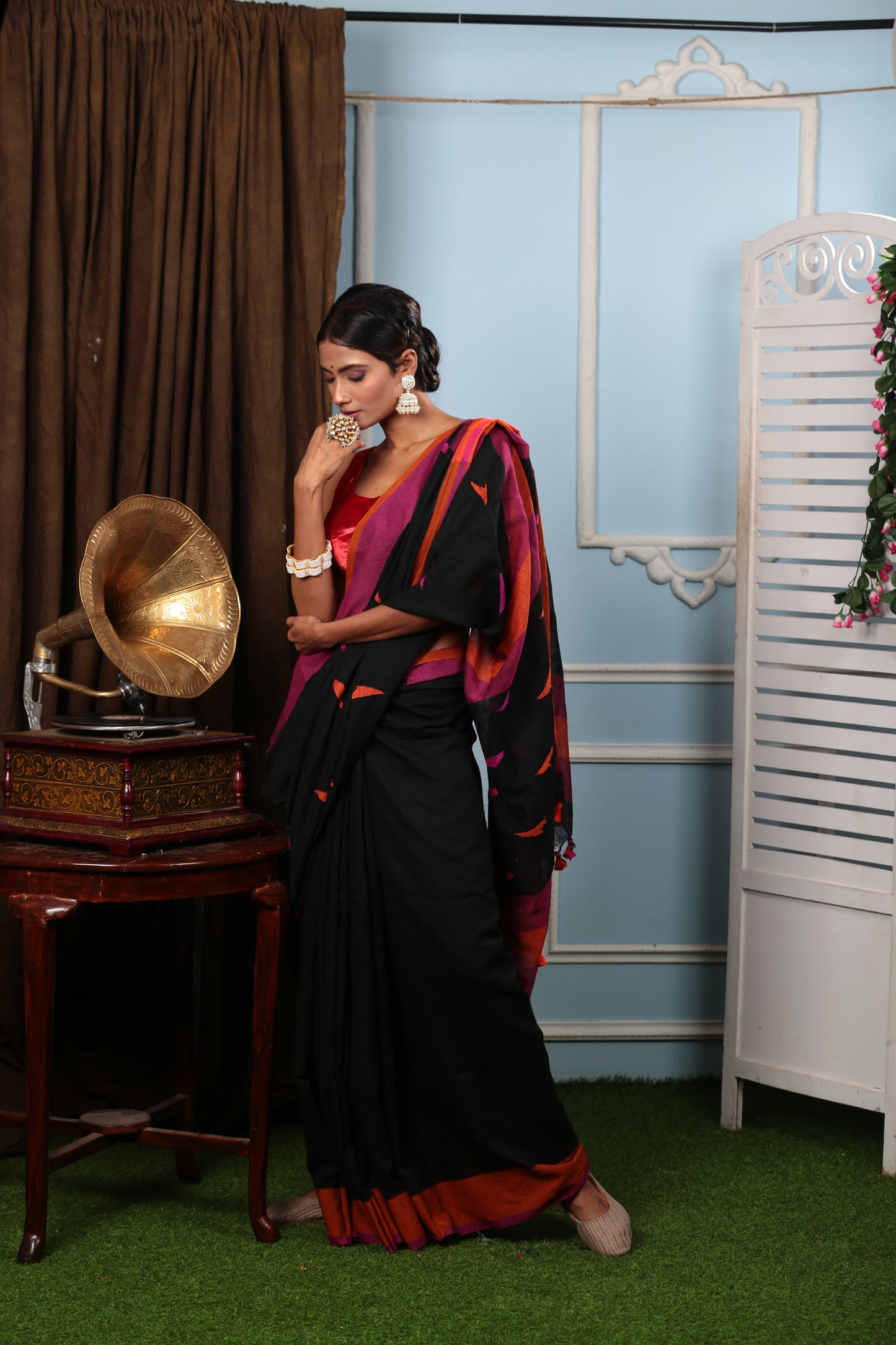 Assamese Khadi saree in black with vibrant pink and orange borders, perfect for traditional occasions. | Urbane Essence