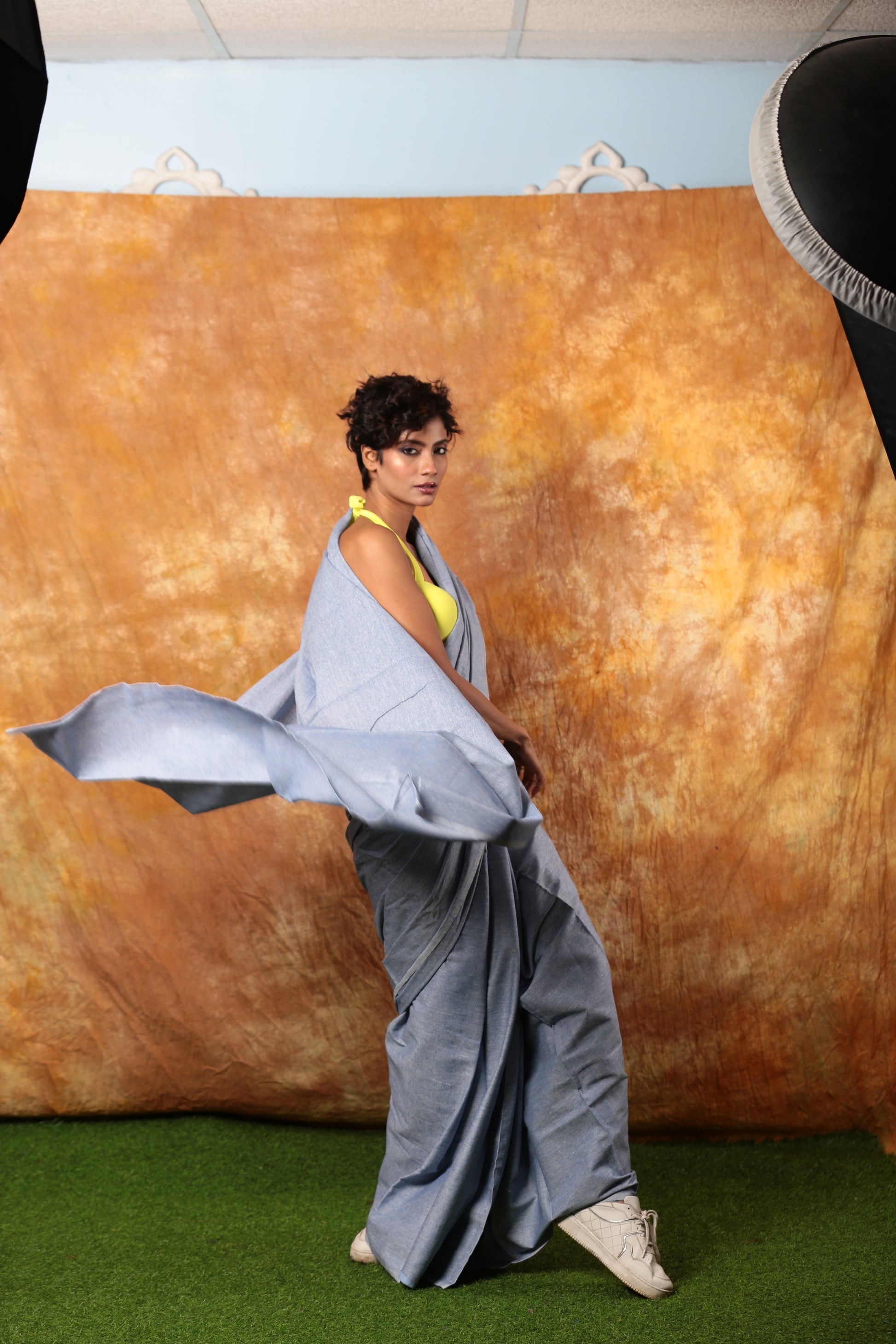 Stylish woman in a light blue denim saree with a yellow blouse, perfect for casual wear | Urbane Essence
