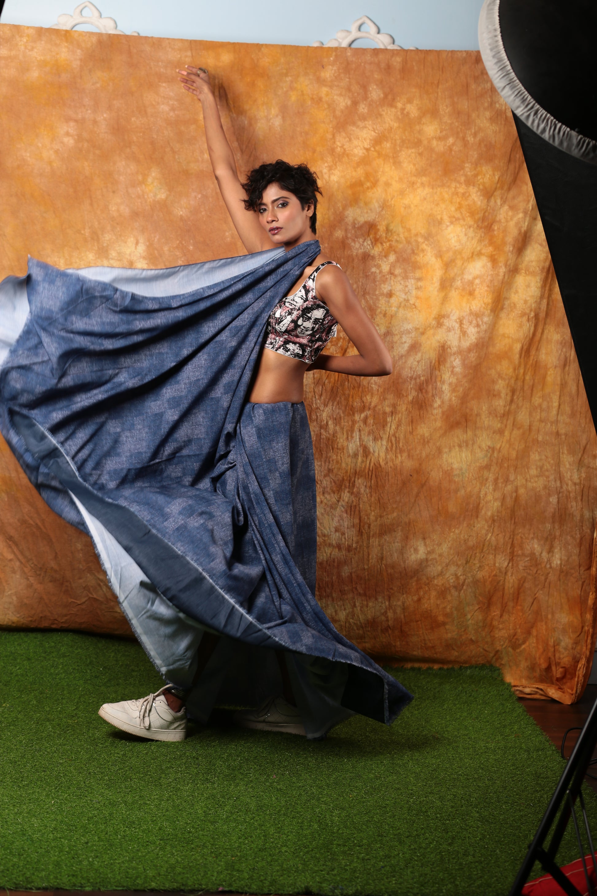 Stylish woman in a flowing blue denim saree, perfect for casual wear. | Urbane Essence