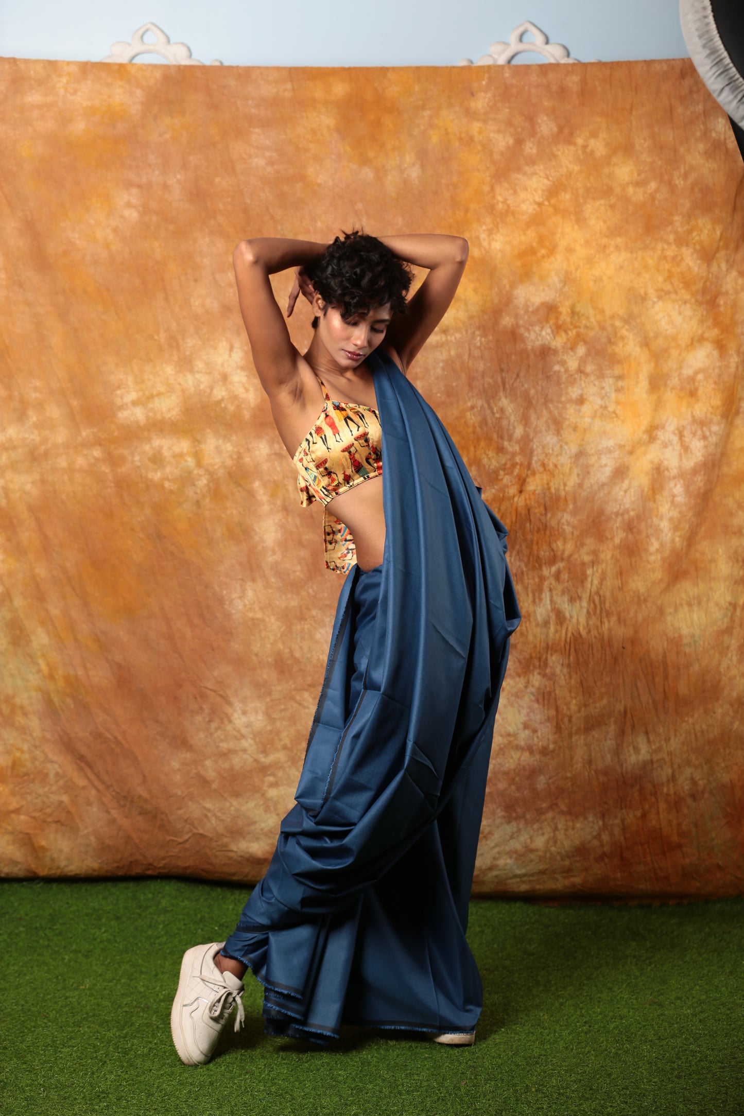 Stylish woman in a blue denim saree with a printed blouse, perfect for casual wear. | Urbane Essence