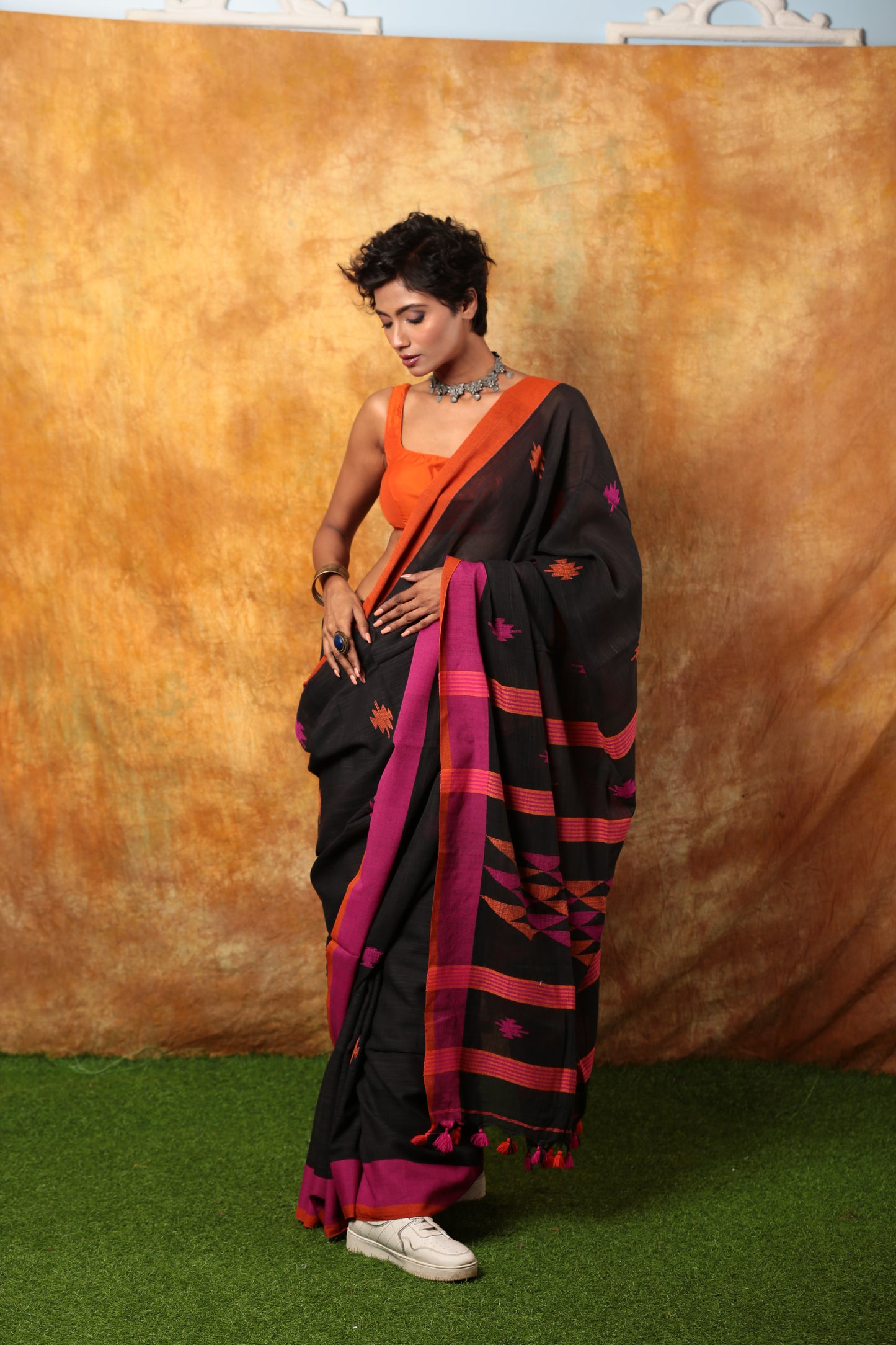 Black Assam Khadi saree with pink and orange border, suitable for festive occasions. | Urbane Essence